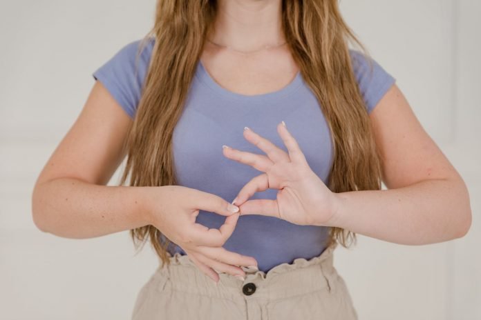 pexels-photo-10029301 close up on womans hands while using sign language
